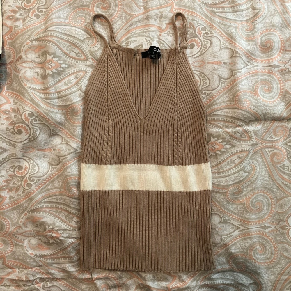 tan and white tank